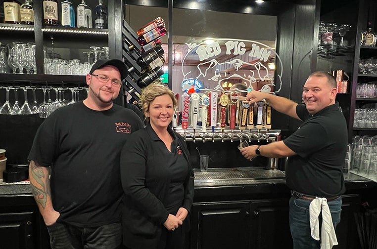 Red Pig Inn Owners behind the bar
